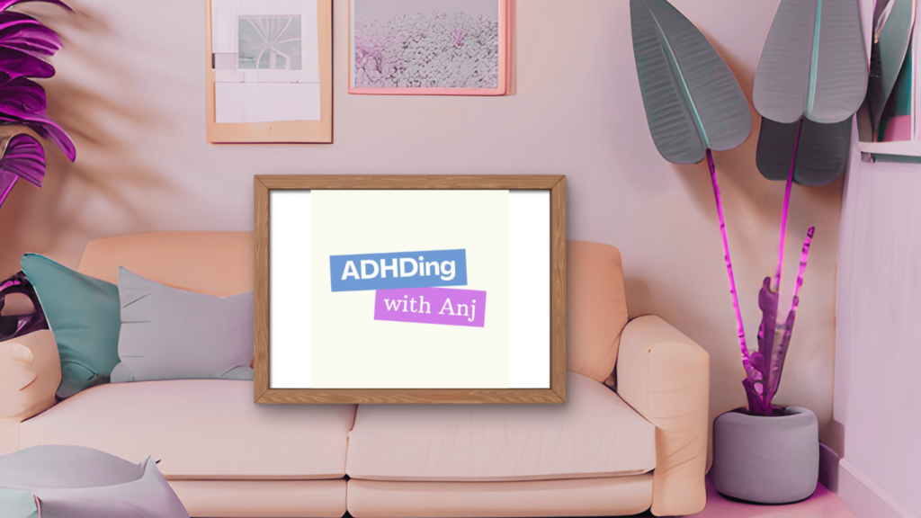Picture of a living room including sofa, plants and pictures. On the sofa is a framed picture of the ADHDing with Anj logo.
